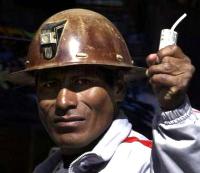 a bolivian miner. with stick of dynamite. photographed after Mr Morales asked them to stop.