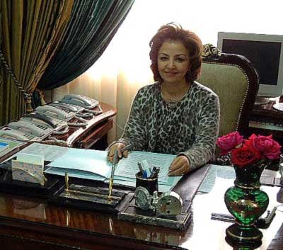 at her office desk. Expert on microbiology, DU and germs. is she Dr Germ or innocent scientist?