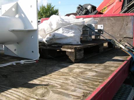 Sacks of flags? Additional equipment for the installation remained on the truck bed as it drove off.