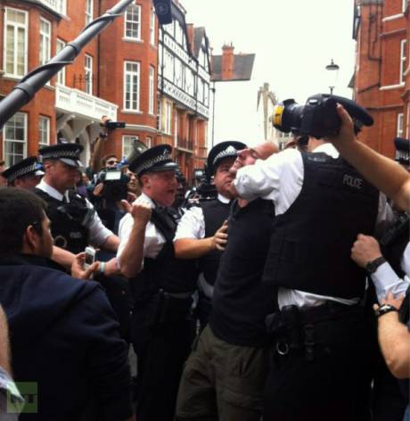 Police Assault Assange Supporters.