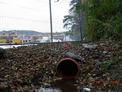 Water unceremoniously channelled down plastic pipe