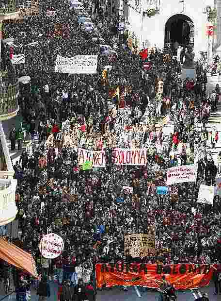 Barcelona students take to the streets AND occupy their universities