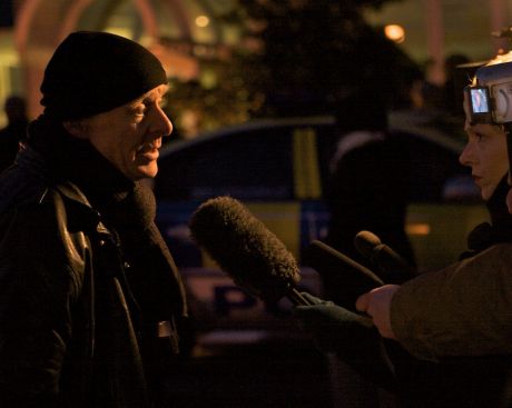 Outside the Raytheon plant in Derry Eamonn McCann talks to the media while nine women remain chained to internal doors blocking access to Raytheon's offices.