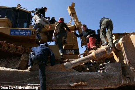 Demonstrators occupying a bulldozer