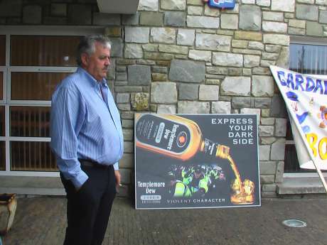 Head of IRMS, Jim Farrell infront of an appropriate sign