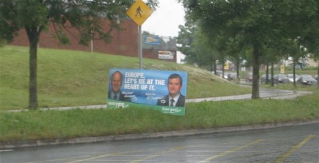 Sign on green area? A distraction to motorists? Obstructing grass cutting? Without consent of Council?