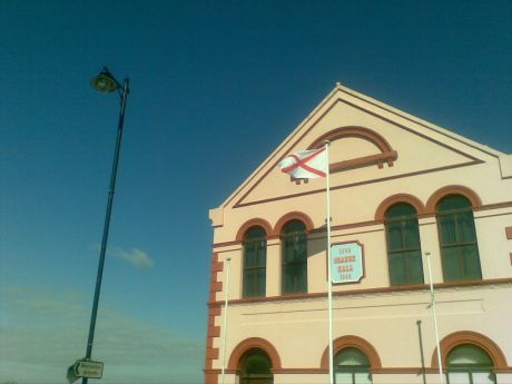 St Patrick's flag flutters in front of Limavady Orange Hall, Co Derry