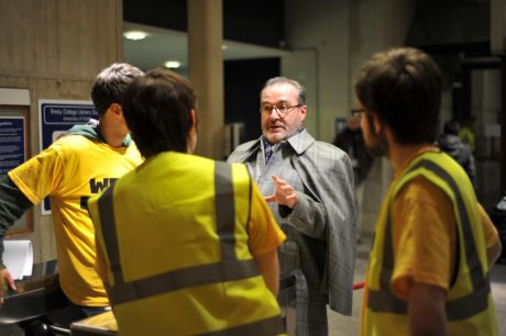 Assistant Junior Dean Joseph O'Gorman is handed a list of demands by the Students' Union officers